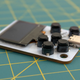 A close-up of the buttons on the front of the Arduboy Mini.